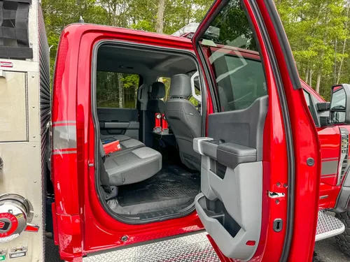 Rear cabin interior view showing seat layout and legroom behind front seats.